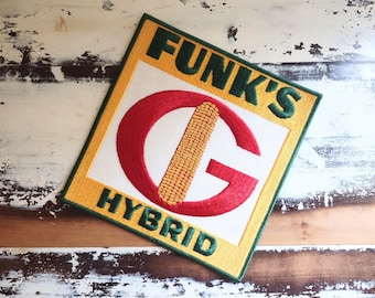 May include: A yellow and green embroidered patch with the text "Funk's Hybrid" and a red and white stylised letter "G" with a corn cob inside.
