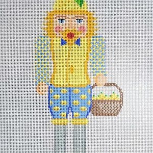 May include: Needlepoint design of a whimsical figure in a yellow hat with a green leaf, yellow vest, blue polka dot shorts, and a basket of lemons. The figure has a blue bow tie and holds a basket of lemons. The word "LEMONDROP" is at the bottom.