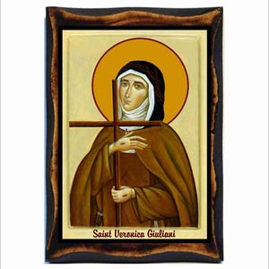 Könnte beinhalten: Eine gerahmte religiöse Ikone der Heiligen Veronica Giuliani. Die Ikone ist in traditionellem Stil mit goldenem Hintergrund und einem Heiligenschein um den Kopf der Heiligen gemalt. Die Heilige ist dargestellt, wie sie ein Holzkreuz hält. Der Text "Saint Veronica Giuliani" steht unter dem Bild.