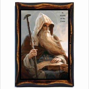 May include: A religious icon painting of St. Mark of the Caves. The painting depicts a bearded man with a long white beard, wearing a brown robe and a white hood. He is holding a staff in his left hand and a book in his right hand. The painting is framed in a dark wood frame.