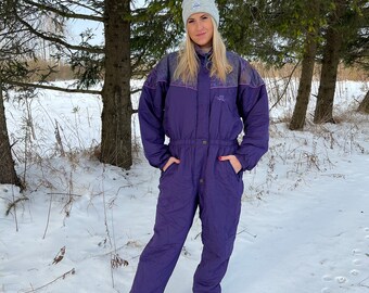 purple ski suit