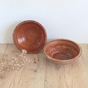 Antique pair of rustic slipware bowls, hand thrown terracotta bowls with hand painted yellow patterns, European redware dishes, 19th Century