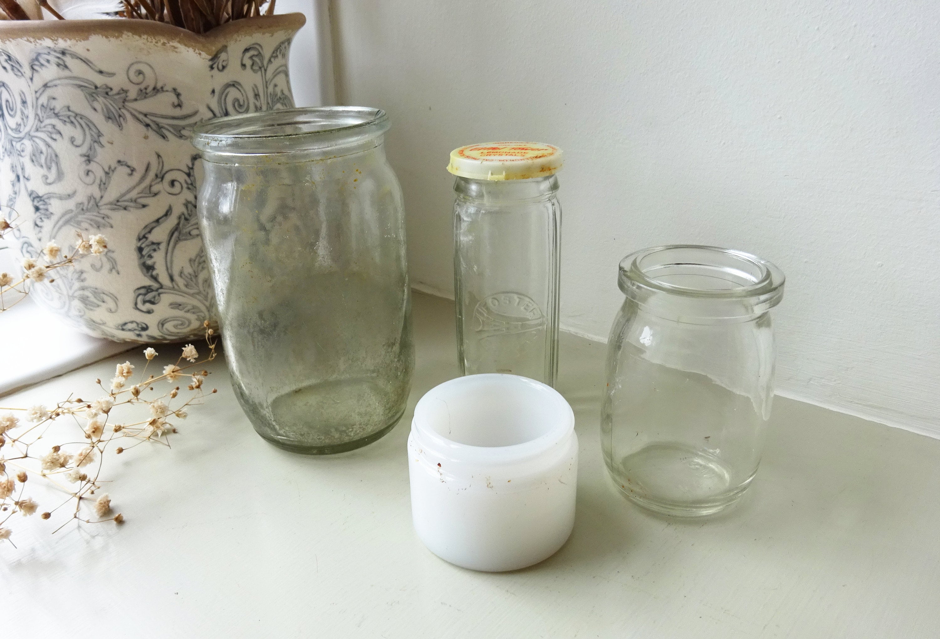 Vintage glass jars and pots x 1 including a preserve jar, milk glass cosmetic pot, fish paste pot and Eiffel Tower Lemonade Crystals bottle