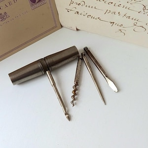 Antique roundlet pocket multitool, travelling plated brass corkscrew, bradawl, screwdriver, awl in screw top case, four tools, mantique gift
