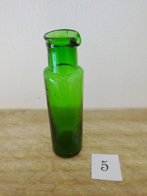 old green perfume bottle