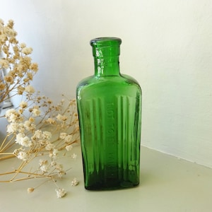 Antique green poison bottle, 2 oz rectangular Not To Be Taken ribbed bottle. Two ounce chemist, pharmacy bottle, vintage bottle, early 20th
