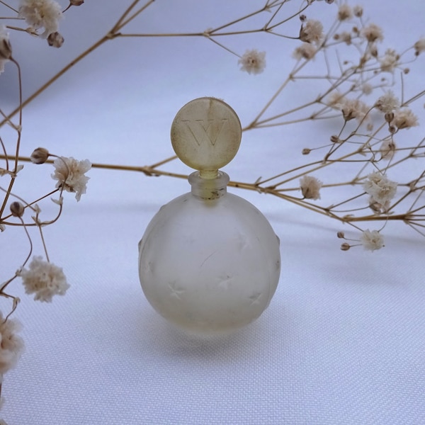 Vintage French perfume bottle, Je Reviens by Worth, small ball shaped frosted glass scent bottle with embossed stars, Lalique design bottle