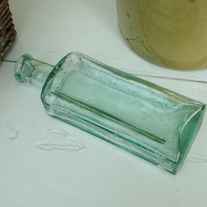 Victorian aqua glass bottle, rectangular, bevelled on three sides. Antique medicine bottle, quack cure bottle, apothecary, pharmacy, chemist