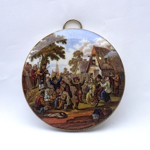 Antique Prattware pot lid, The Village Wedding, framed Victorian transfer printed earthenware pot lid, black painted wooden frame, Teniers