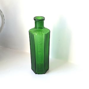 Antique Not To Be Taken 4 oz green poison bottle, Wood Bros hexagonal ribbed bottle, embossed chemist pharmacy druggist bottle, bud vase