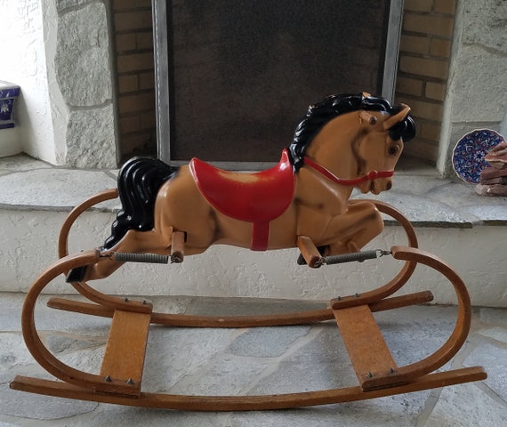 old rocking horse with springs