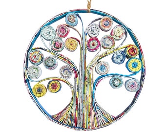 May include: Circular wall hanging featuring a tree design made from rolled paper. The tree has a blue outline, with colorful rolled paper circles representing leaves. A natural twine loop is attached for hanging. The artwork is set against a white background.