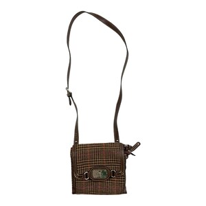 May include: A brown and tan plaid crossbody bag with a brown leather strap and a silver buckle.