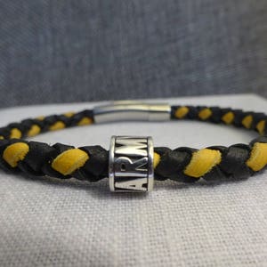 US Army Black and Gold Braided Leather Bracelet with a Sterling Silver Army Bead stamped 925.