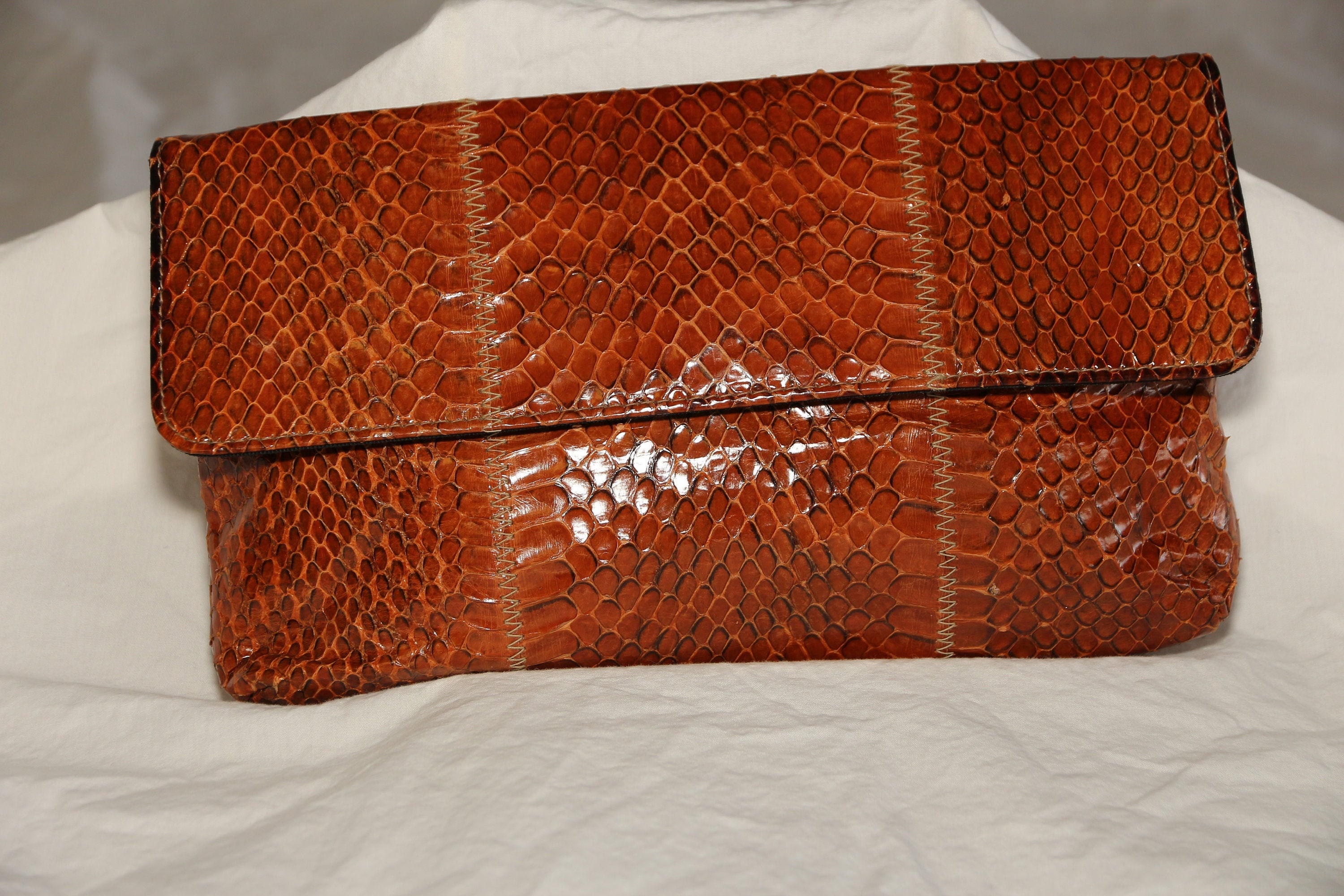 Brown snake print clutch bag cheap