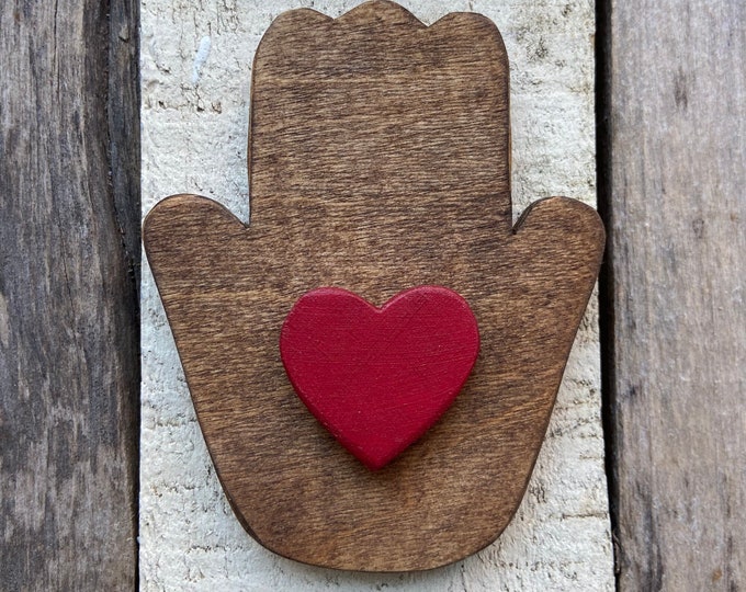 handmade wooden heart in hand ornament