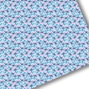 May include: A blue background with a repeating pattern of blue Stitch characters with pink ears and a white smile.