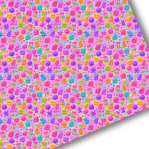 May include: A repeating pattern on a pink background featuring colourful candy illustrations including gummy bears, popsicles, and small star shapes. Each candy element displays a simple smiling face, rendered in vibrant shades of blue, yellow, orange, and purple.