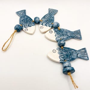 Handgemaakte keramische viswandhanger: woondecoratie