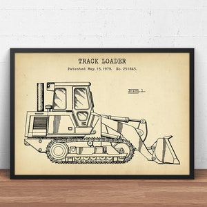 Könnte beinhalten: Schwarz-weiß-Linienzeichnung eines Trackloader-Patents. Das Patent trägt den Titel "TRACK LOADER" und das Patentdatum ist der 15. Mai 1979. Die Patentnummer lautet 251845.