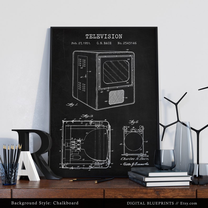 May include: A black and white vintage patent drawing of a television set on a chalkboard background. The patent drawing is titled "TELEVISION" and includes the patent number "2543146". The drawing shows a side view of the television set and includes details of the internal components.