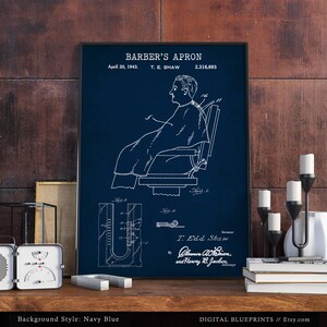 May include: A vintage blueprint illustration of a barber's apron, patent number 2,316,893, dated April 20, 1943. The illustration shows a person sitting in a barber's chair wearing the apron. The blueprint is on a navy blue background.