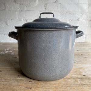 May include: A large grey enamel stock pot with a lid. The pot has two handles and a speckled grey finish.