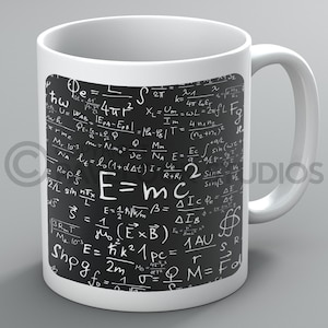 May include: White ceramic mug with a black square design featuring a variety of scientific formulas and equations, including the famous equation E=mc². The design is reminiscent of a chalkboard.