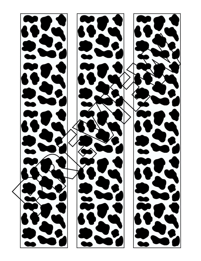 May include: Three vertical strips of black and white animal print fabric. The print resembles a cowhide pattern.