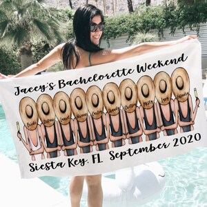 May include: White beach towel with a graphic of a group of women wearing black bathing suits and straw hats. The text "Jaccy's Bachelorette Weekend" and "Siesta Key, FL September 2020" is printed on the towel.