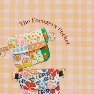 May include: Two small rectangular pouches labeled The Foragers Pocket. The top pouch features a patchwork design of floral and strawberry patterns in green, orange, and yellow. The bottom pouch has a white fabric with a red, blue, and pink floral print.
