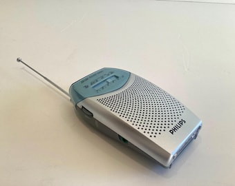 Radio de bolsillo vintage Philips AE1505, años 90, FM/AM, portátil, color plateado, probada y en funcionamiento.