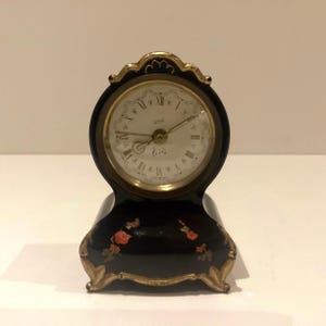 Table Alarm Clock (1950s) “Ariel” Musical Alarm Made In Switzerland