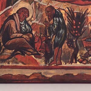 May include: A section of a religious icon painting, featuring figures in various poses. The color palette includes reds, browns, and gold, with a focus on the depiction of human forms and symbolic elements. The artwork appears to be aged.