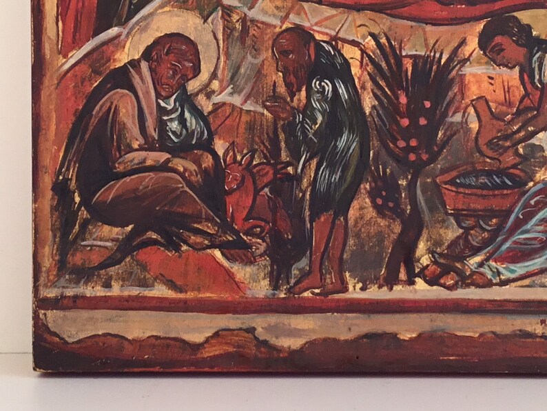 May include: A section of a religious icon painting, featuring figures in various poses. The color palette includes reds, browns, and gold, with a focus on the depiction of human forms and symbolic elements. The artwork appears to be aged.