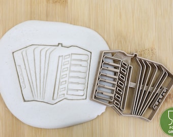 Musical instrument accordion/horn/piano/guitar/drums/harp/harmonica/tuba/saxophone cookie cutter fondant approx.8 cm