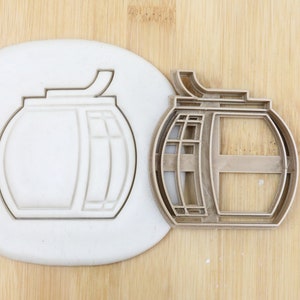 May include: A metal cookie cutter in the shape of a cable car. The cutter is food grade and has a detailed design.
