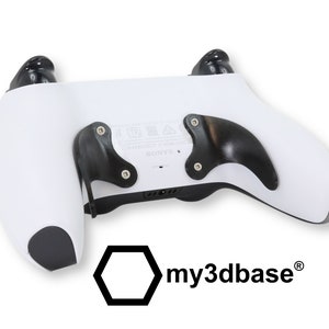 May include: White PlayStation 5 DualSense controller with black back paddles and grips. The controller has the my3dbase logo on the back.