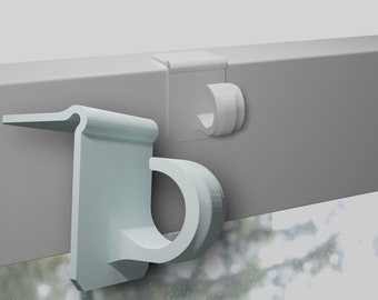 May include: Two white plastic hooks for hanging curtains or blinds. The hooks are designed to be attached to a window frame.
