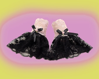 Elegant gothic wedding cuffs made of black rose lace with a fluffy swinging skirt