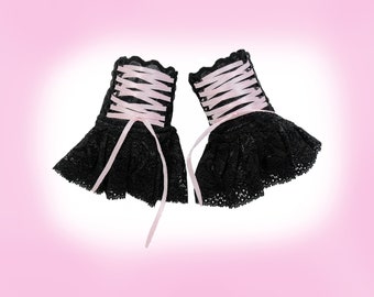 Gothic black cuffs with pink lacing, swinging skirt with a slight shine