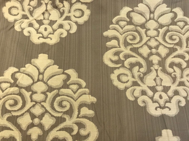 Embossed Oatmeal Brown Ornamental Motif On Almond Brown Cotton Blend