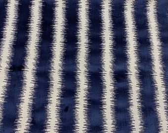 May include: A navy blue and white striped fabric with a subtle chevron pattern. The fabric has a soft, textured feel.