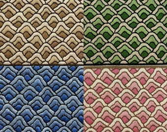 May include: A collection of four fabric swatches featuring a repeating wave pattern. Each swatch displays a distinct color scheme: tan and cream, green and light green, blue and light blue, and pink and cream, all with dark embroidered outlines.