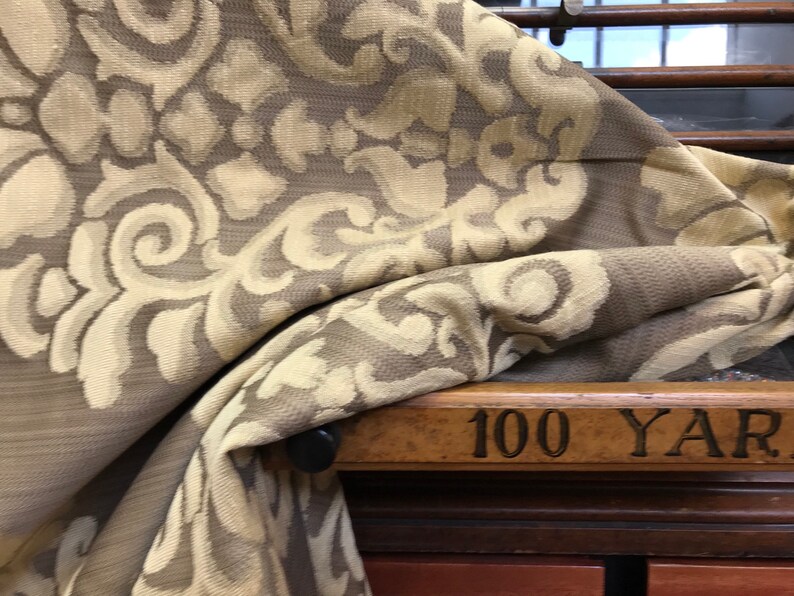 Embossed Oatmeal Brown Ornamental Motif On Almond Brown Cotton Blend