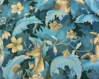 May include: A tapestry featuring a repeating pattern of stylized deer and flowers in shades of blue, green, and gold. The deer are depicted in a woodland setting with leafy branches and vines.
