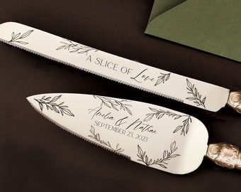 May include: A wedding cake knife and server set with silver handles and engraved blades. The blades feature leaf designs and the text "A Slice of Love." The server is inscribed with names and a date.