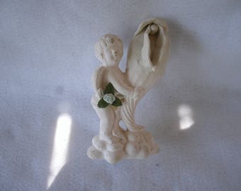 Sculpted Vulva in a Ceramic Standing Putti Holding A Vase 78