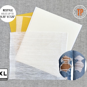 May include: A white fabric patch kit for repairing holes in denim. The kit includes a large white fabric patch, a smaller white fabric patch, and a sheet of adhesive paper. The kit is labeled "RESTYLE HOLES UP TO 9.25" X 7.25" and "XL ORIGINAL".