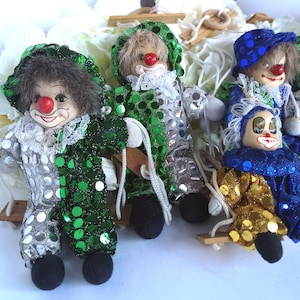 Clown da compagnia, Clown da circo in sacchi di sabbia in ceramica, Bambole clown oscillanti da collezione, Clown in porcellana su un&#39;altalena decorativa, Clown seduti felici